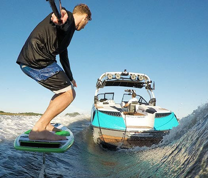 hydrofoil surfing behind boat
